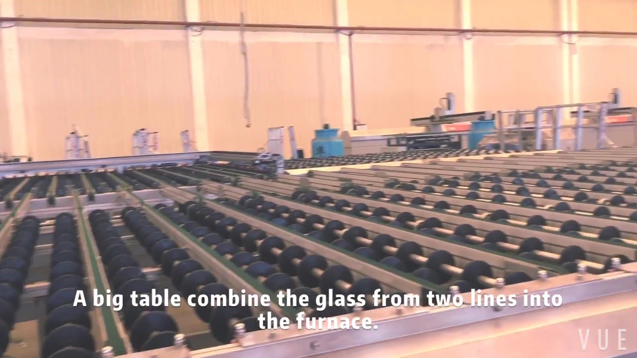 Glass processing plant with automatic tempering lines