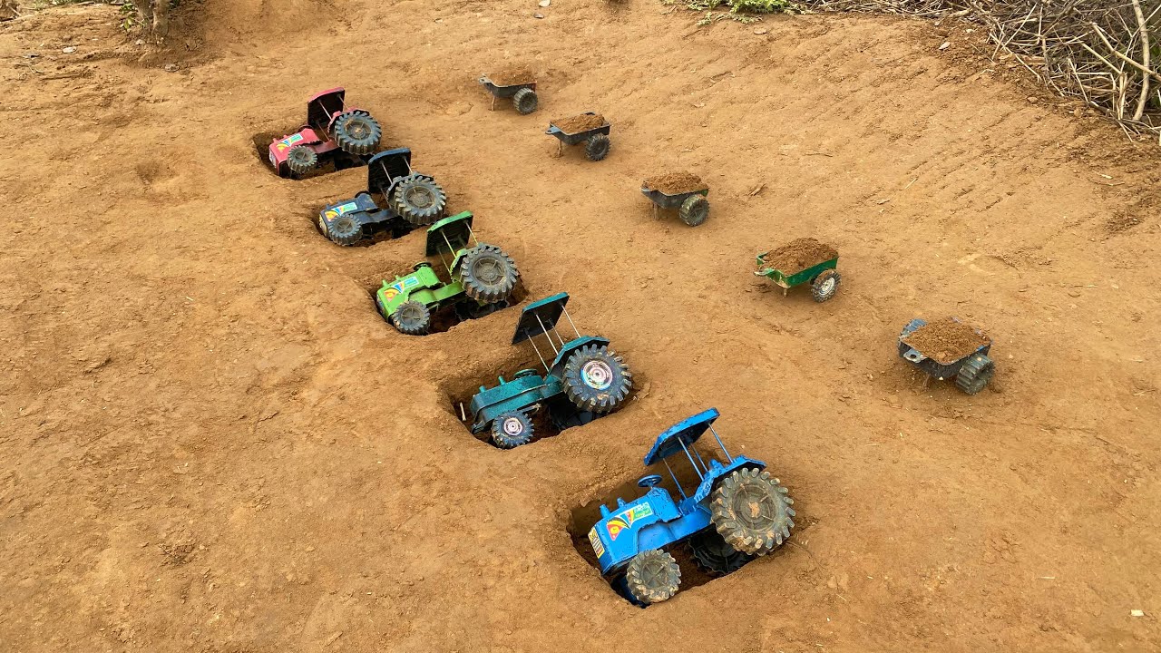 The tractor carrying the trolley full of soil overturned in the ditch.