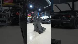 A Podium Level Seat For A Podium Standing Car