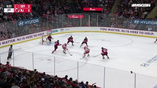 Jonathan Huberdeau scores a goal against the New Jersey Devils