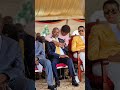 Minister Jane Ruth Aceng saying a prayer to the next Deputy Speaker of the 12th Parliament at Kololo