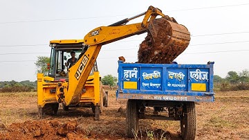 3DX JCB Backhoe Loader Machine Loading Red Mud in Swaraj 744 XT Tractor For Plot Cutting