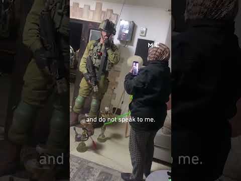 Palestinian woman scolds Israeli soldiers raiding her home as she smokes shisha