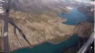 Microlight flying lessons amongst sunlit mountains and lakes in the French Alps