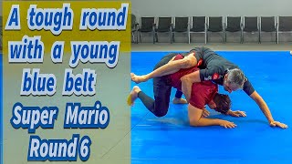 A tough round with a young blue belt