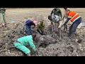 The men rescued a poor baby elephant that had been swept away by floodwaters.