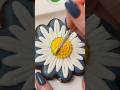 I made daisy cookies with royal icing
