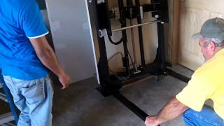 Wheelchair Lift Installation - Setting The Vertical Platform Lift In Place