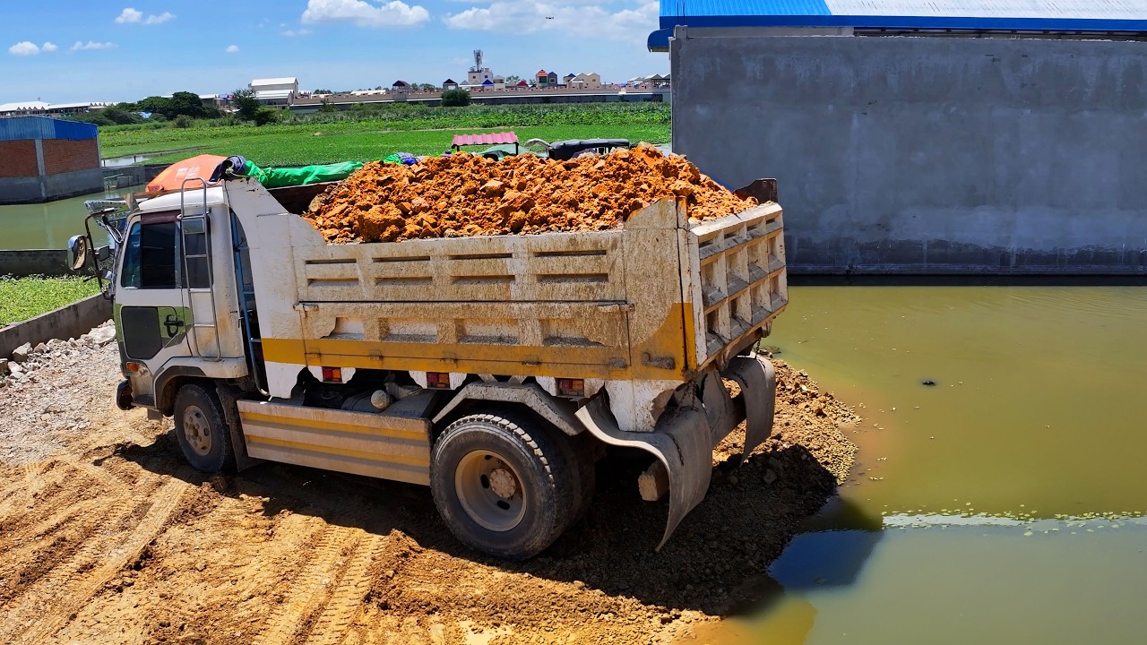 incredible best skill landfill project , truck unload transport soil with bulldozer push soil stone