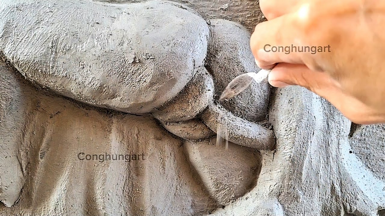 Make beautiful cement reliefs of cobras wrapped around trees and caves