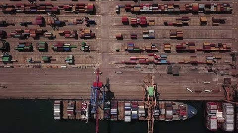 Industrial Cargo Area with Container Ship in Dock at Port, Aerial View | Stock Footage - Videohive