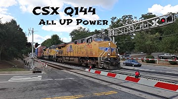 UP 7712 C45ACCTE Leads CSX Train Q144 Southbound at Spring St in Smyrna, GA