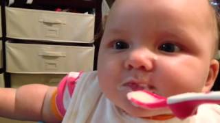 Baby eating rice cereal first time
