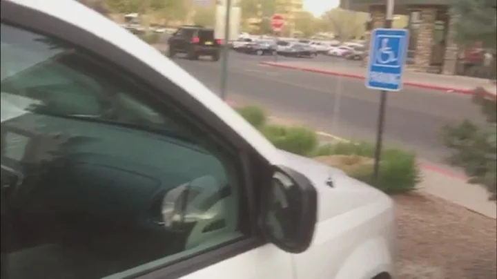 State employee parks marked van in handicap spot without placard