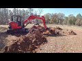 Kubota Mini Excavator Digging Out Stumps