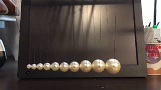 Newtons Cradle with Tapered Mass