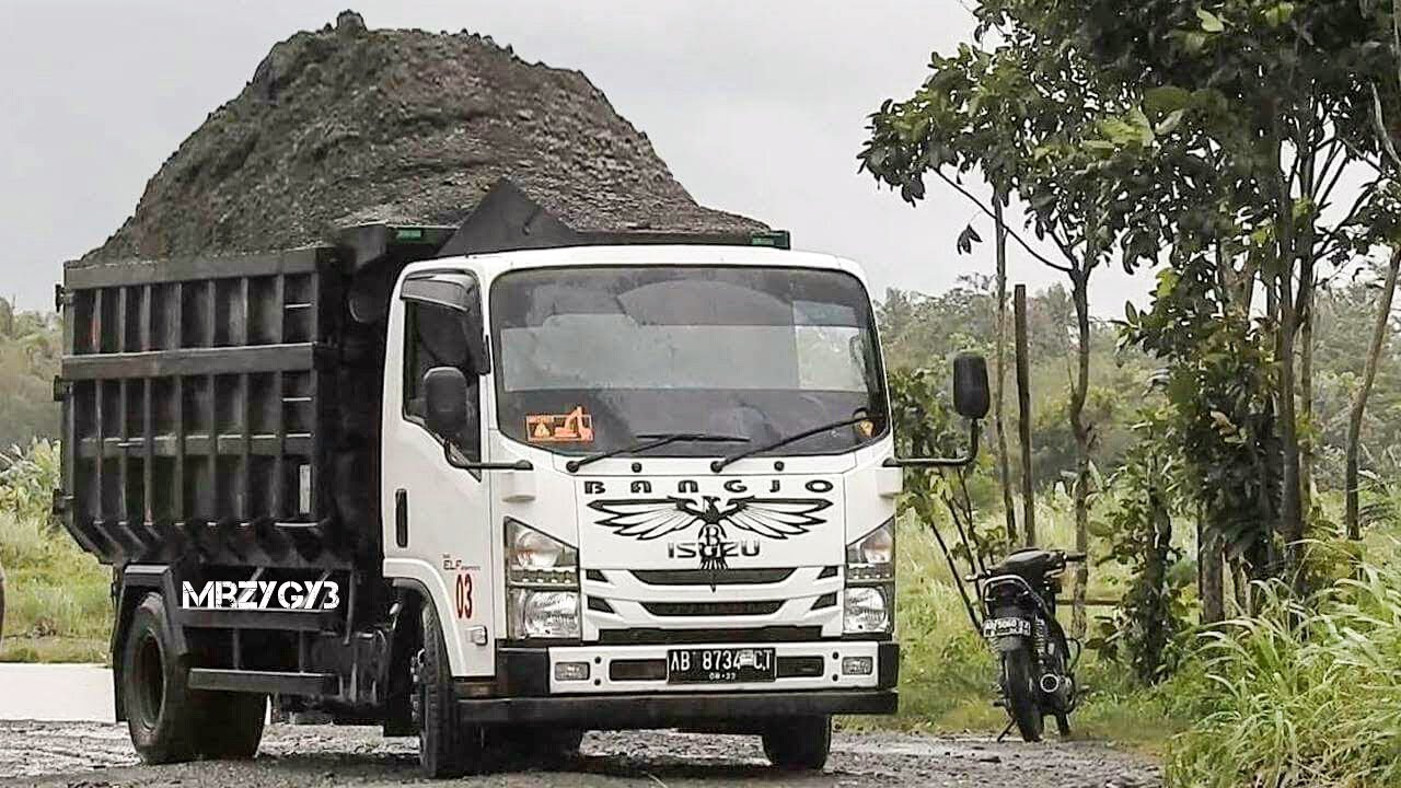 Overloaded Dump  Truck Stuck Pulled By Kobelco SK200 