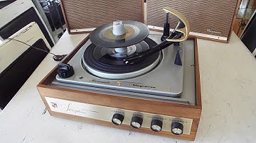 Magnavox stereo record player playing a stack of 45