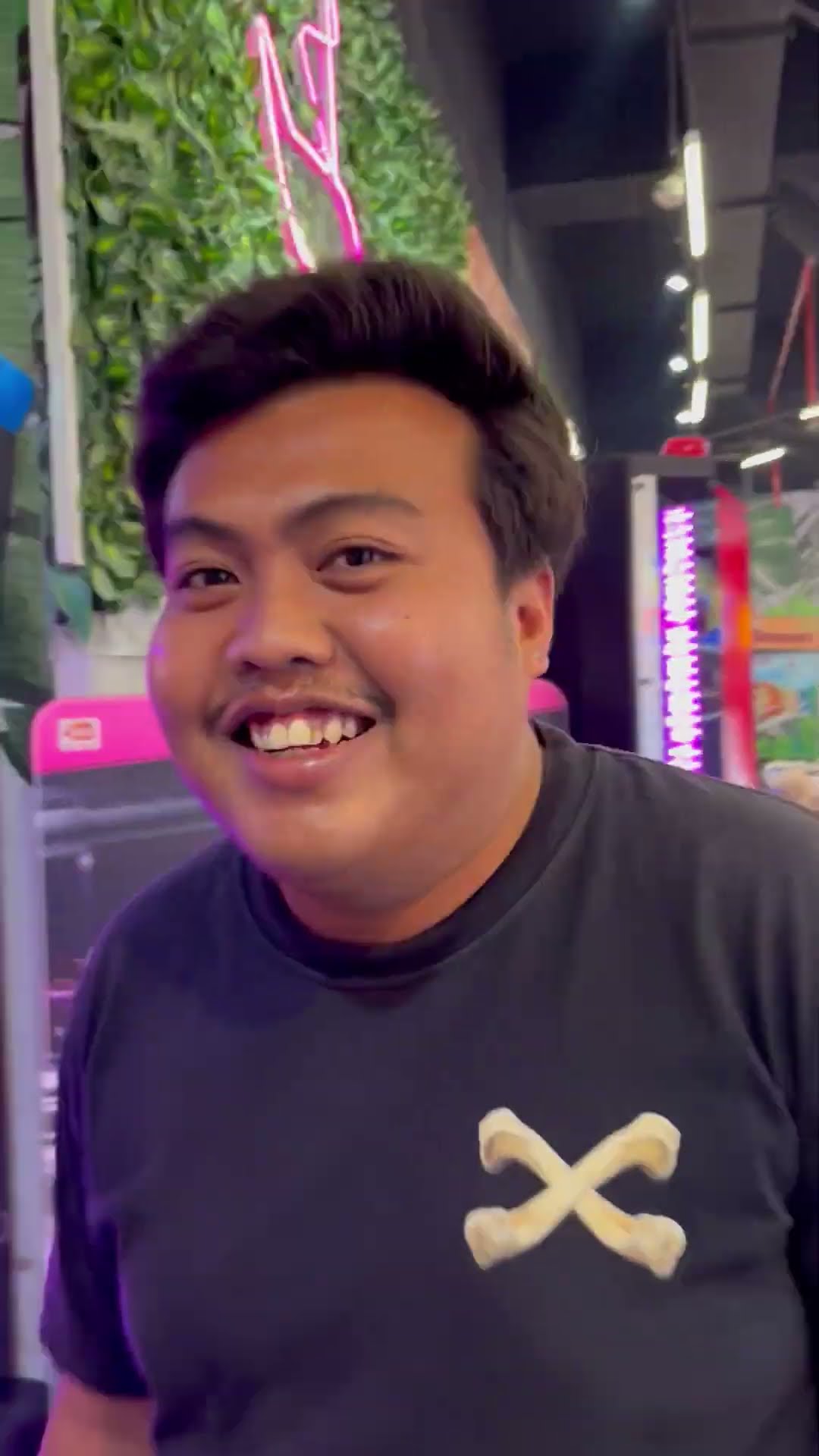 Young Man Lands Powerful Punch on Boxing Arcade Machine