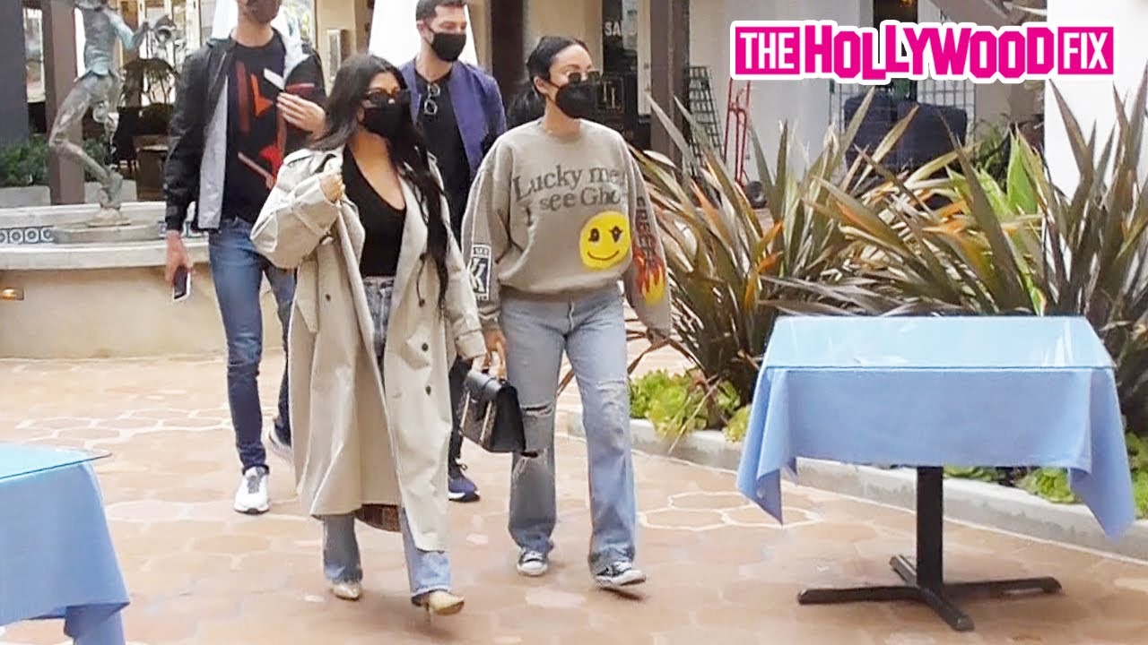 Kourtney Kardashian & Stephanie Shepherd Rock A Trench Coat & Yeezy Merch To Lunch At Taverna Tony