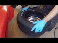 Mounting new tire by hand
