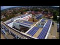 A 200kW (around 750 x 270W panels) solar array on the West Kent College site in Tonbridge. The Array was designed and engineered by Greenman Solar, Ashford Kent. There's 50kW of all black, LG Solar modules, with Solar Limpet mountings on the slate roof and 150kW of 270W Talesun Modules, mounted on K2 frames, with around 20 tonnes of concrete ballast, on the flat roof areas. The array was engineered over a five week period in July/August 2018.