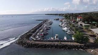 Lahaina, Maui. Slow fly by of beach, bay harbor and sunset!