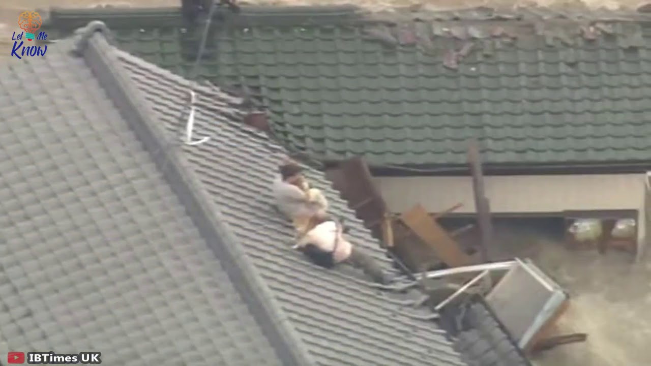 Couple Stranded On A Roof As Flood Waters Rage Refuses To Be Rescued ...