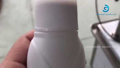 Automatic milk plastic bottle wheel rolling capping machine with cap feeder testing video