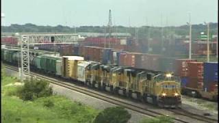 Westbound manifest freight passes by Global-3 outside of Rochelle