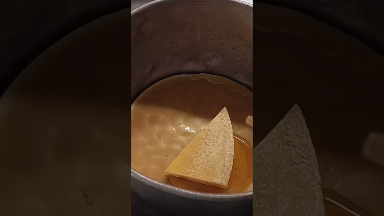 Putting foundation wax on beehive frames 