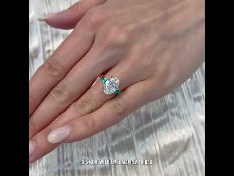 2.8 carat Oval Lab Diamond with Green Emeralds