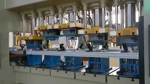 Multi-cylinder deep drawing hydraulic press for making oil filter cans