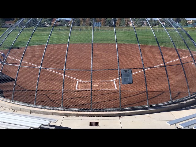 Grooming and chalking a softball field class=