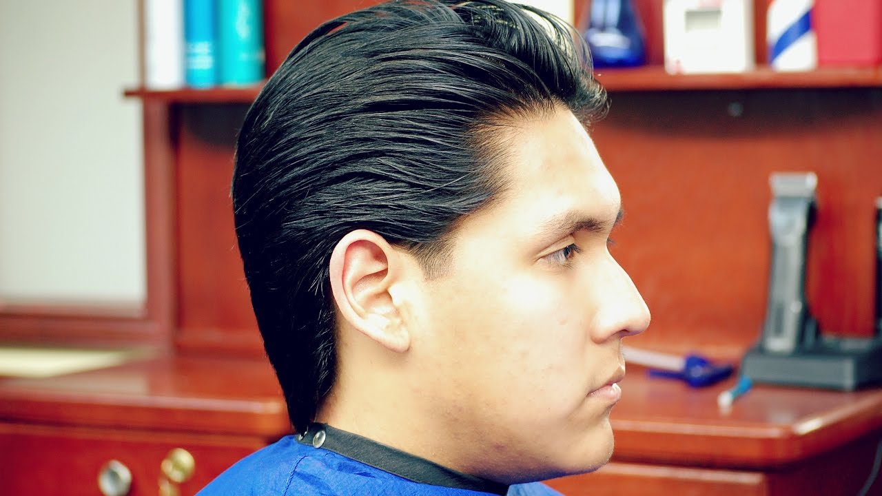 cutting men's hair with razor