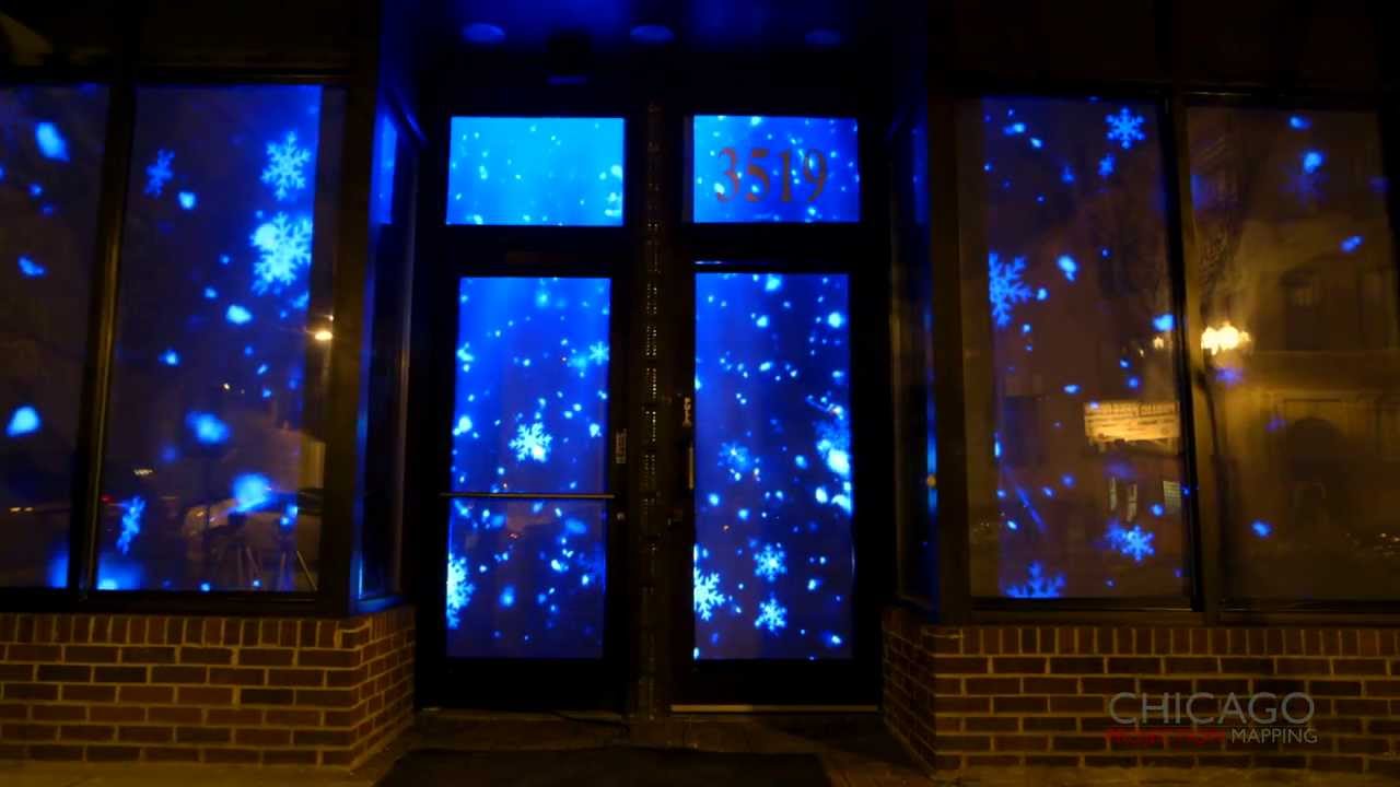 3d projection mapping of winter themed snowflakes on christmas projection led lights