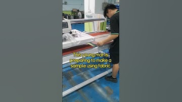 This young man is preparing to make a sample using fabric.