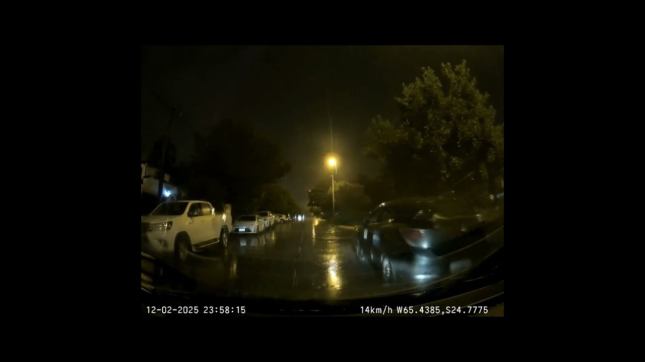 Idiot drives without lights on in heavy rain