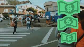 BaguioGoldmanstatue [] asking for dollars × Session Road [] Corner Calderón [] Sky World Building.
