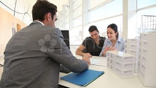 Couple In Real-Estate Agency Signing Property Loan Contract. Stock Footage screenshot 3