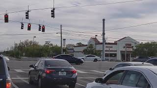 Orange County Sheriffs Office FL Chevy Impala responding code 3 thru intersection.