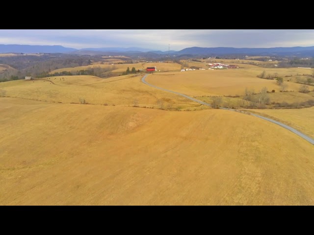 Cinematic drone flight in the country set to Seeing Angels by Billy Burke class=