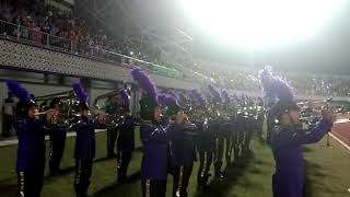 Menyanyikan lagu kebangsaan Indonesia raya diringi dengan marching band panca Widya karya
