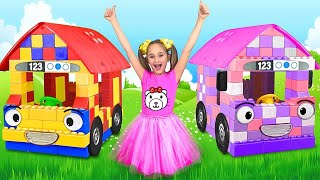 Sasha Playing With Colored Blocks Toy Buses