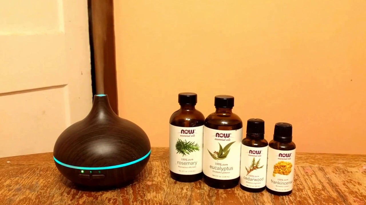 The VicTsing 150ml woodgrain ultrasonic diffuser w/ color-changing light in action