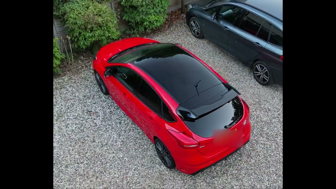 DJI Mini 3 Pro drone taking aerial footage of 2018 MK3 Ford Focus RS Red Edition.