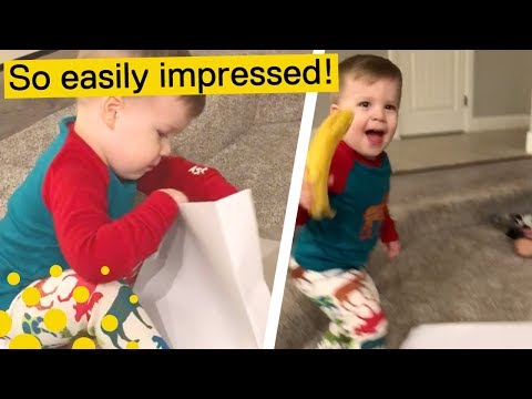 KID RECEIVES BANANA FOR CHRISTMAS (AND LOVES IT)
