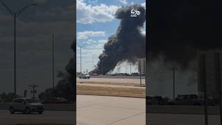 Crews battle Oklahoma City recycling plant fire as huge black cloud fills the sky