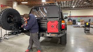 Dissent OffRoad, tire carrier swing arm with table. Easy open, slam shut.