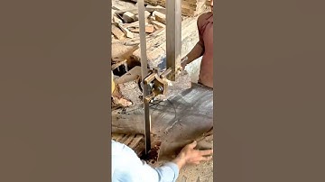 Workers Cutting Large Wooden Logs Using Vertical Bandsaw Machine